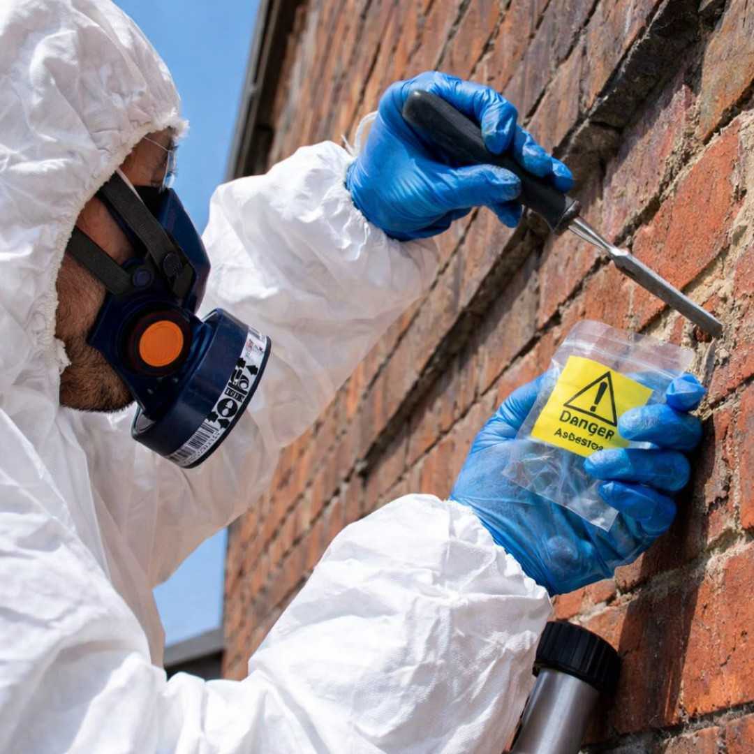 speciialist getting sample for Asbestos Testing